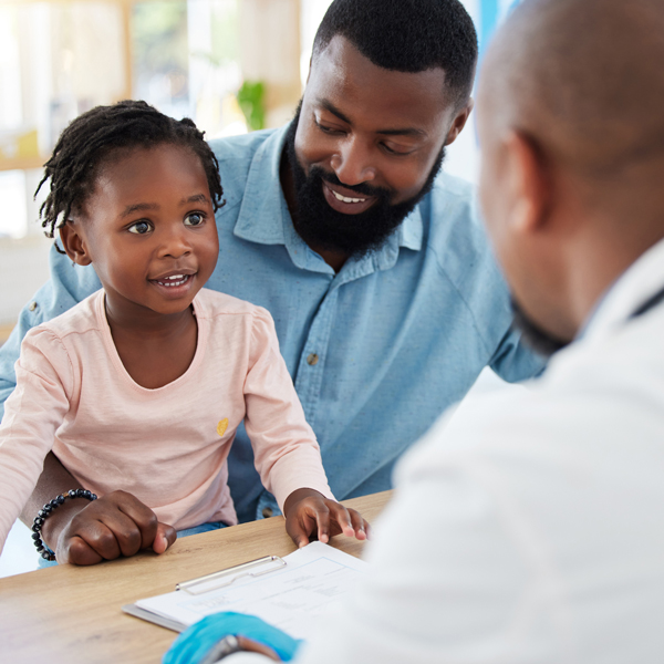 Doctor consulting with family